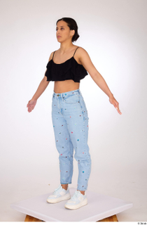 Jimena a-pose black ruffled crop top blue embellished jeans casual…